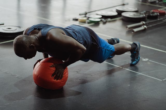 A person is performing burpees complete body exercise