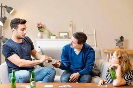 Two People are playing cards Men and Mental Health