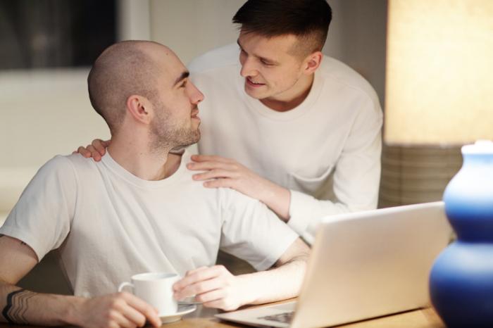 two people site together on sofa Men and Mental Health