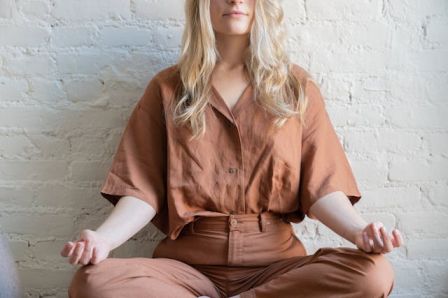 Person Meditating or Practicing Yoga Symbolizing mindfulness and relaxation techniques for mental wellness tips for mental wellness