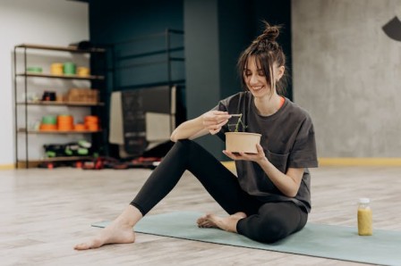 A person making or enjoying a healthy meal, representing diet and nutrition's impact on mental wellness tips for mental wellness