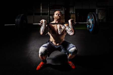 A person performing bodyweight squats entire body workout