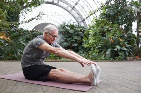 someone doing a Forward Fold Stretch stretch exercises for whole body